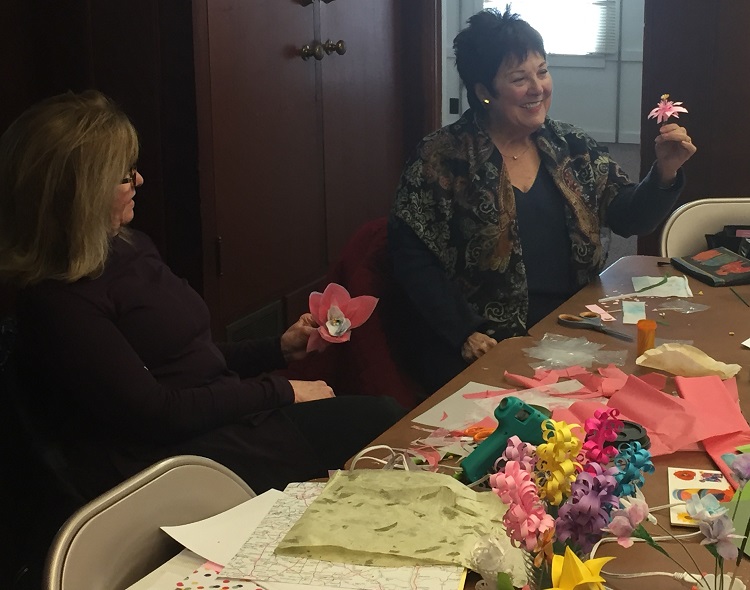 SIU Women's Club activity making paper flowers