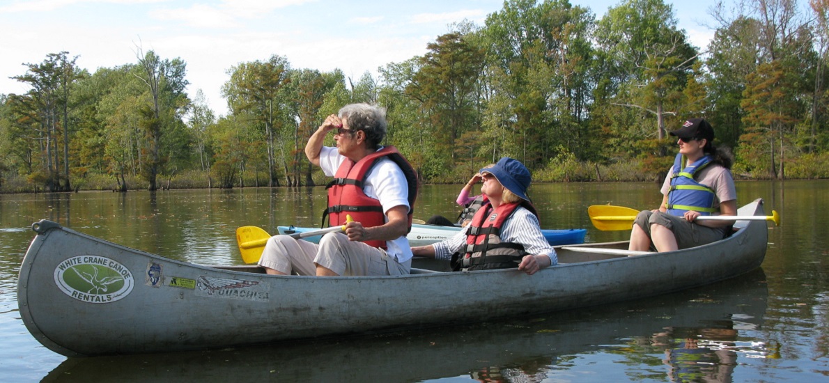 three women in a canoe